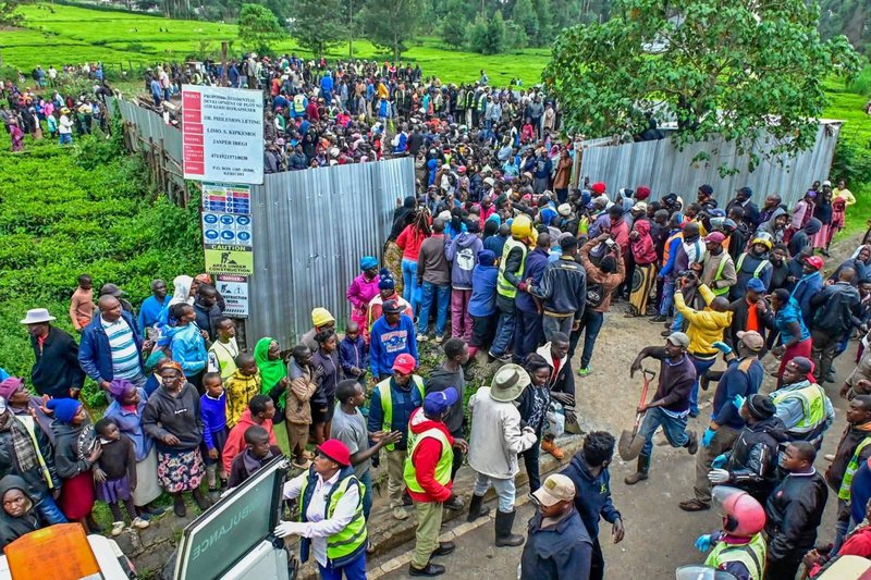Members of the public mill around a colapsed building Kericho. The building which was under construction came down brrying more than 20 people. Photo/Courtesy