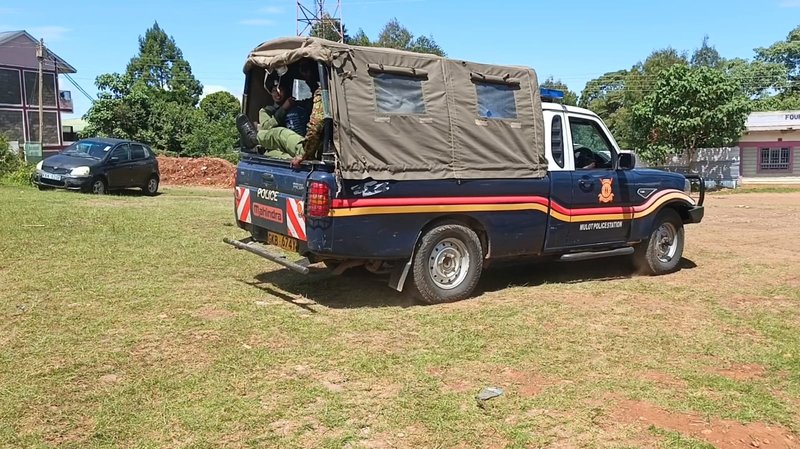A police vehicle that was used to whisk away the suspect from the hands of members of the public who were baying for his blood.